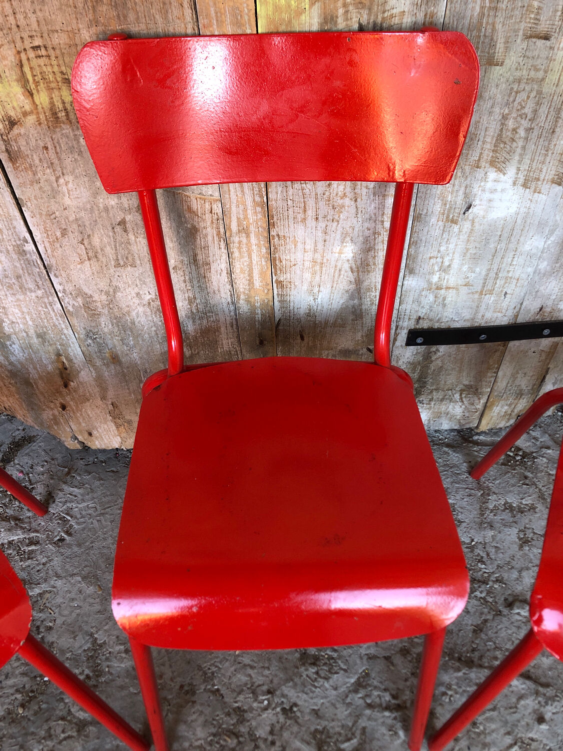 Set of 4 red metal chairs