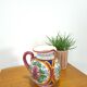 Porseleinen vintage roze kan met bloemen
