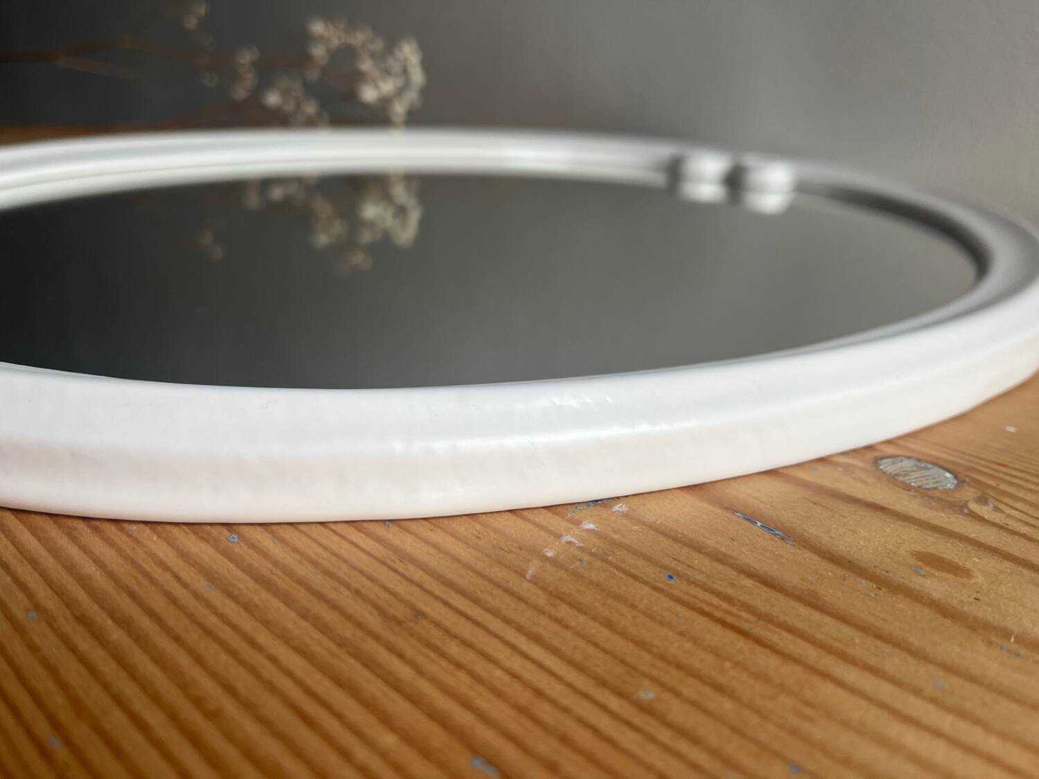 Vintage oval mirror in white enamelled cast iron