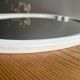 Vintage oval mirror in white enamelled cast iron
