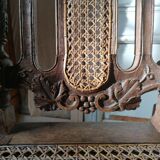 Chair with a decoration of foliage and bunches of grapes