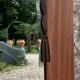 Miroir oval biseauté sur porte art déco Acajou 79x162