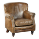 Robust cowhide armchair in a beautifully subtle size with a wonderful patina.