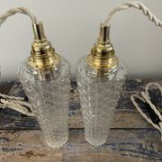 Set of two vintage electric chiseled glass walking lamps