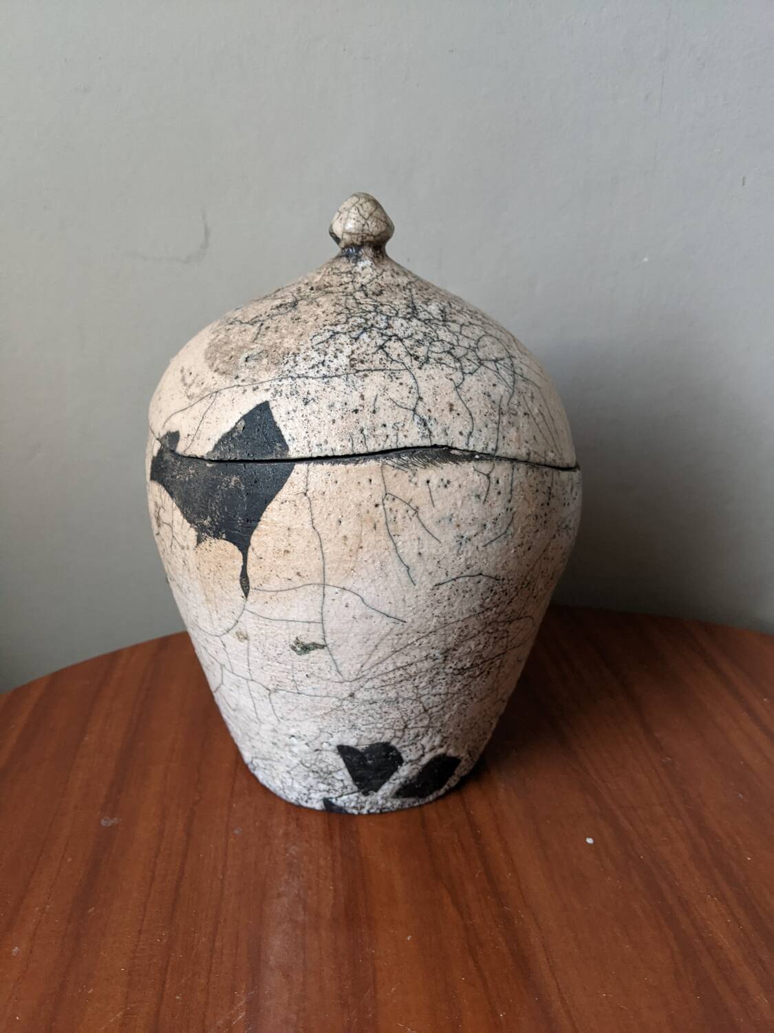Handmade raku ceramic pot in contemporary Japandi design.