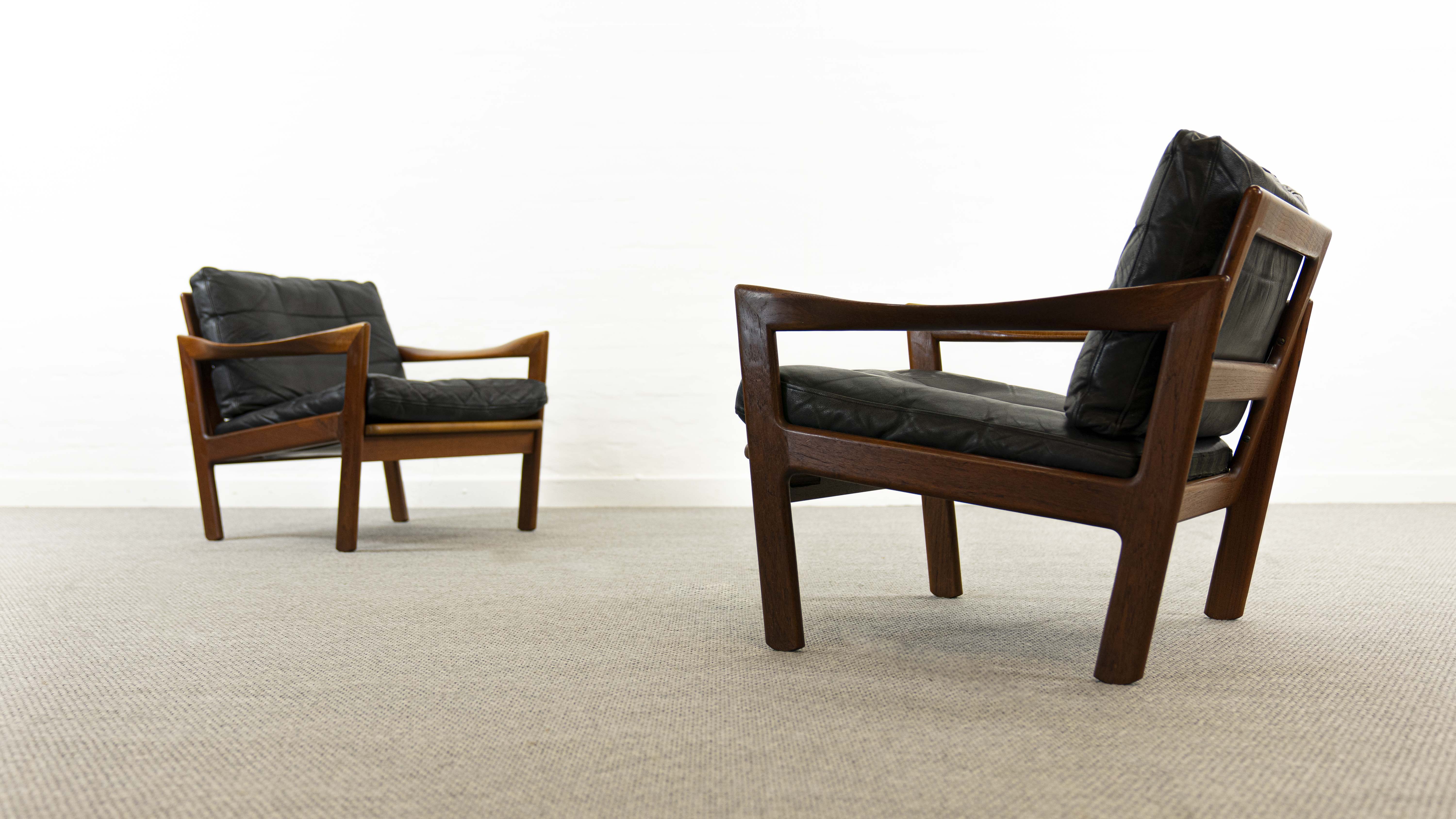 Pair of teak chairs in black leather by Illum Wikkelsoe for Niels Eilersen, Denmark