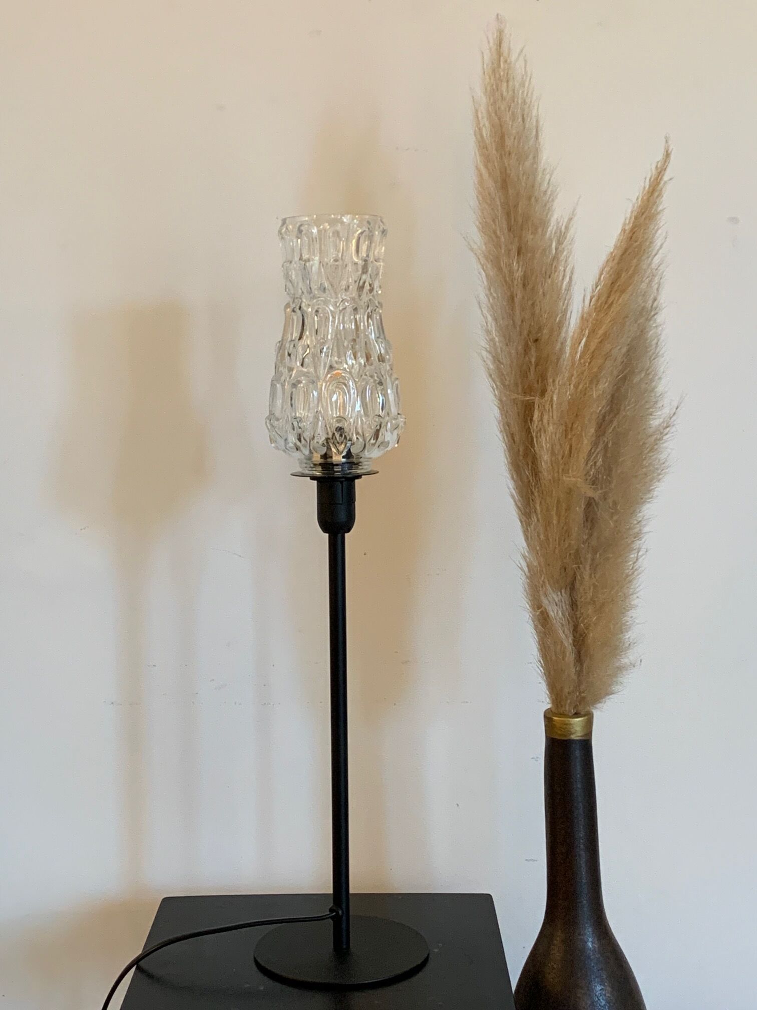 Table lamp with an antique bubbled glass lampshade in the shape of a tulip