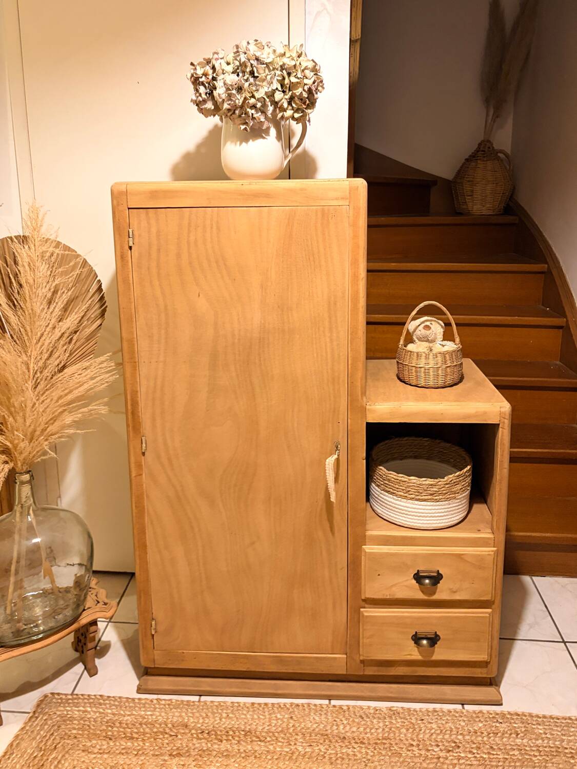Asymmetrical cabinet made of raw wood