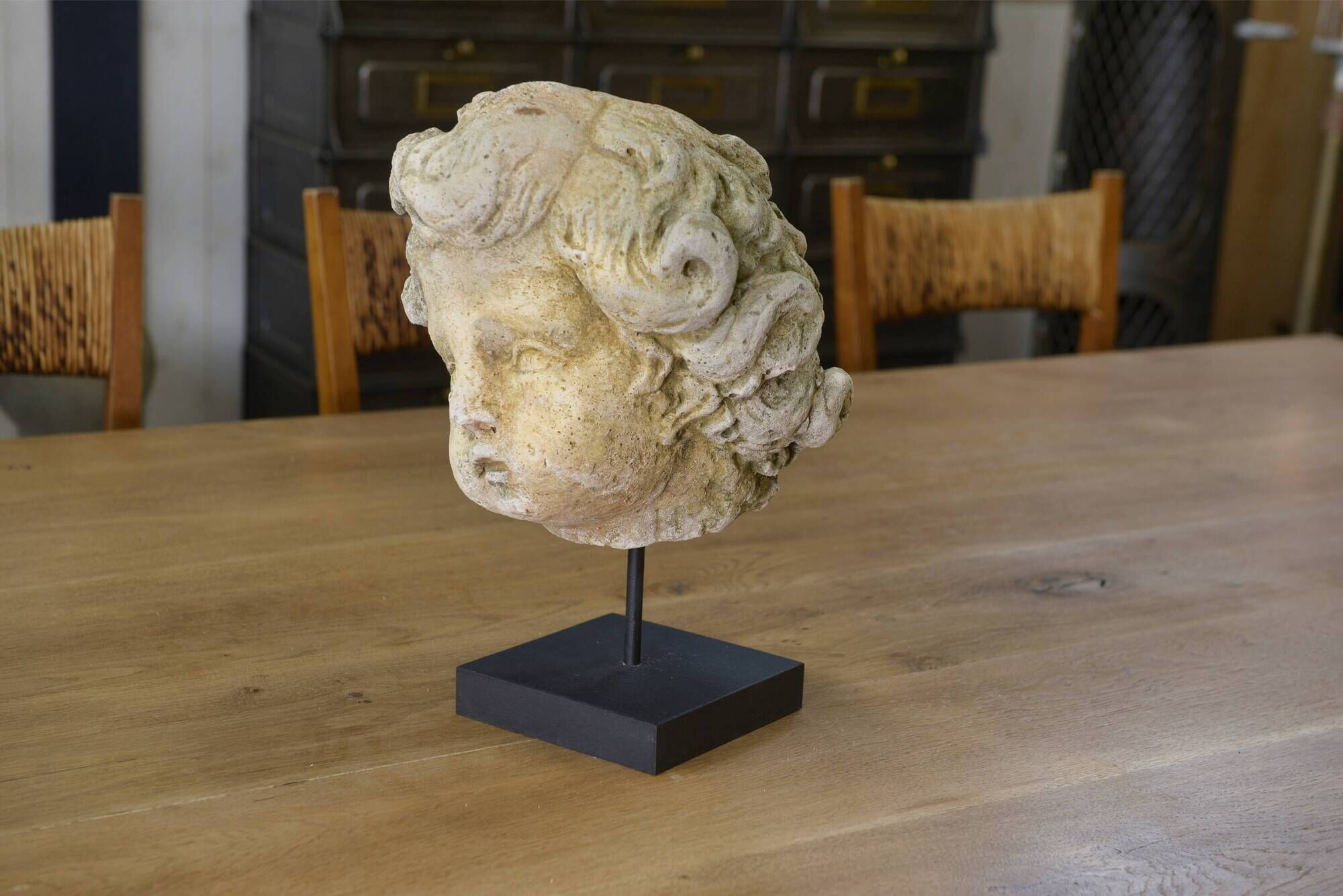 Reconstituted stone sculpture in antique style from the 20th century.