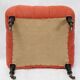 Napoleon III salon armchair in brick red linen with a tufted footrest.
