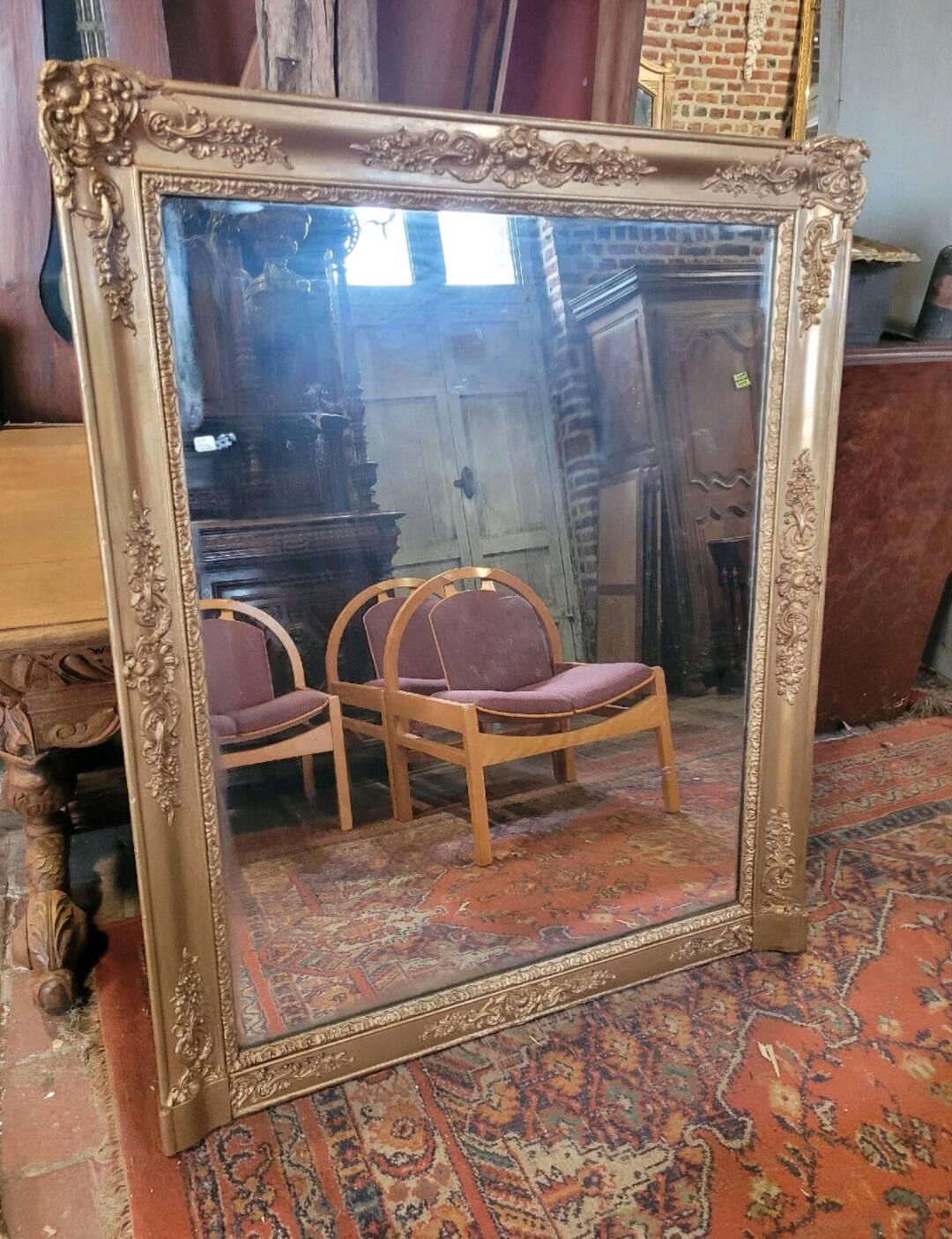 Antique gilded mirror from the 19th century, mercury mirror.