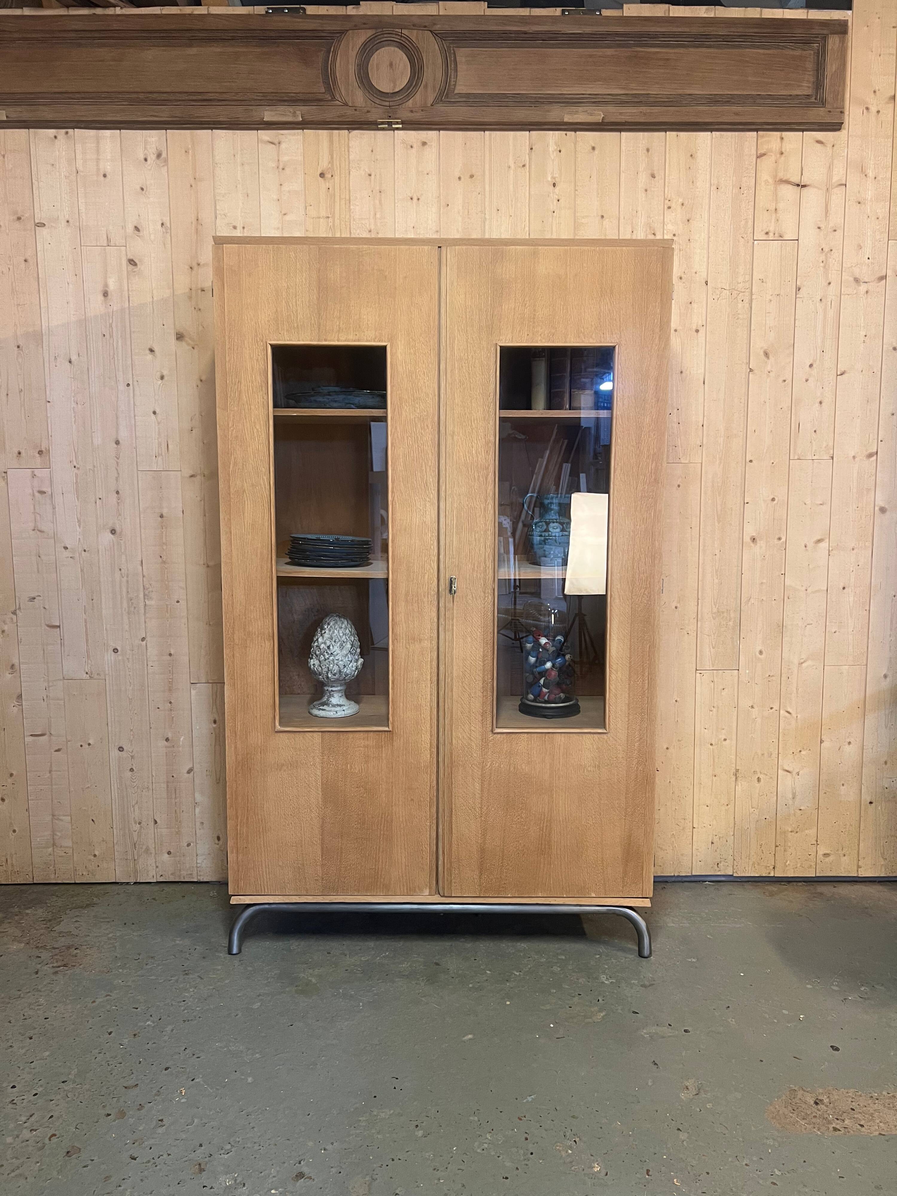 Glass-fronted school cabinet in raw oak