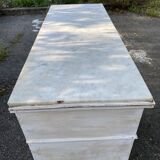 Old chest of drawers in bleached wood with white marble top
