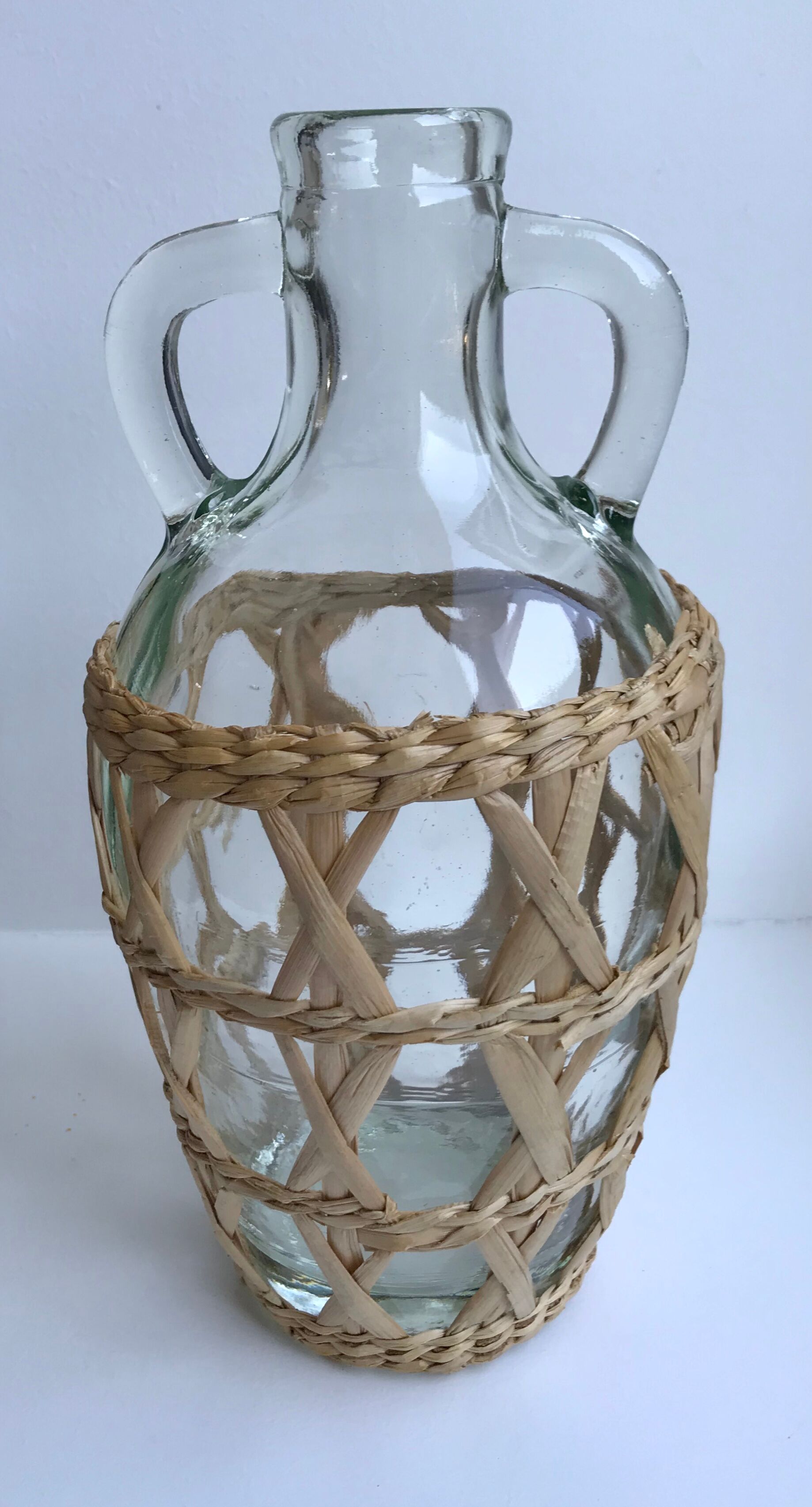 Bottle with handle and covered with wicker / rattan 70s