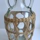 Bottle with handle and covered with wicker / rattan 70s