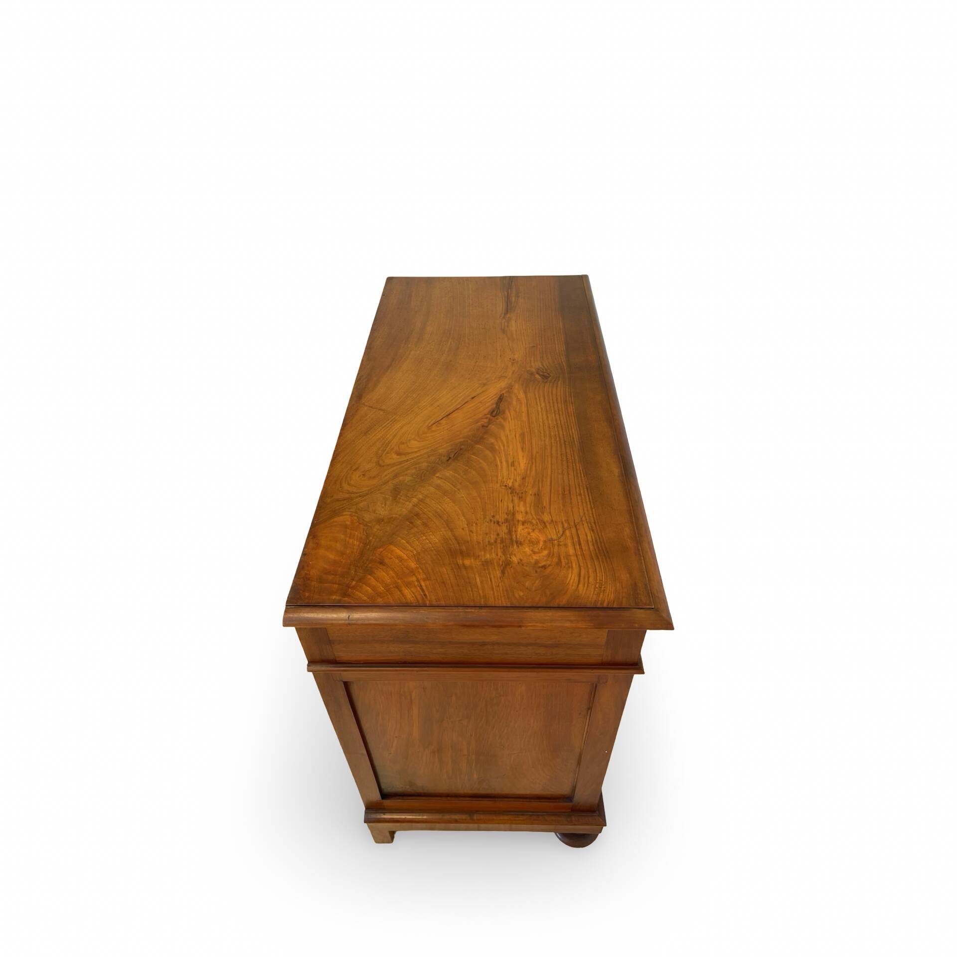 Antique walnut commode with bronze handles in the shape of a lion's mask,