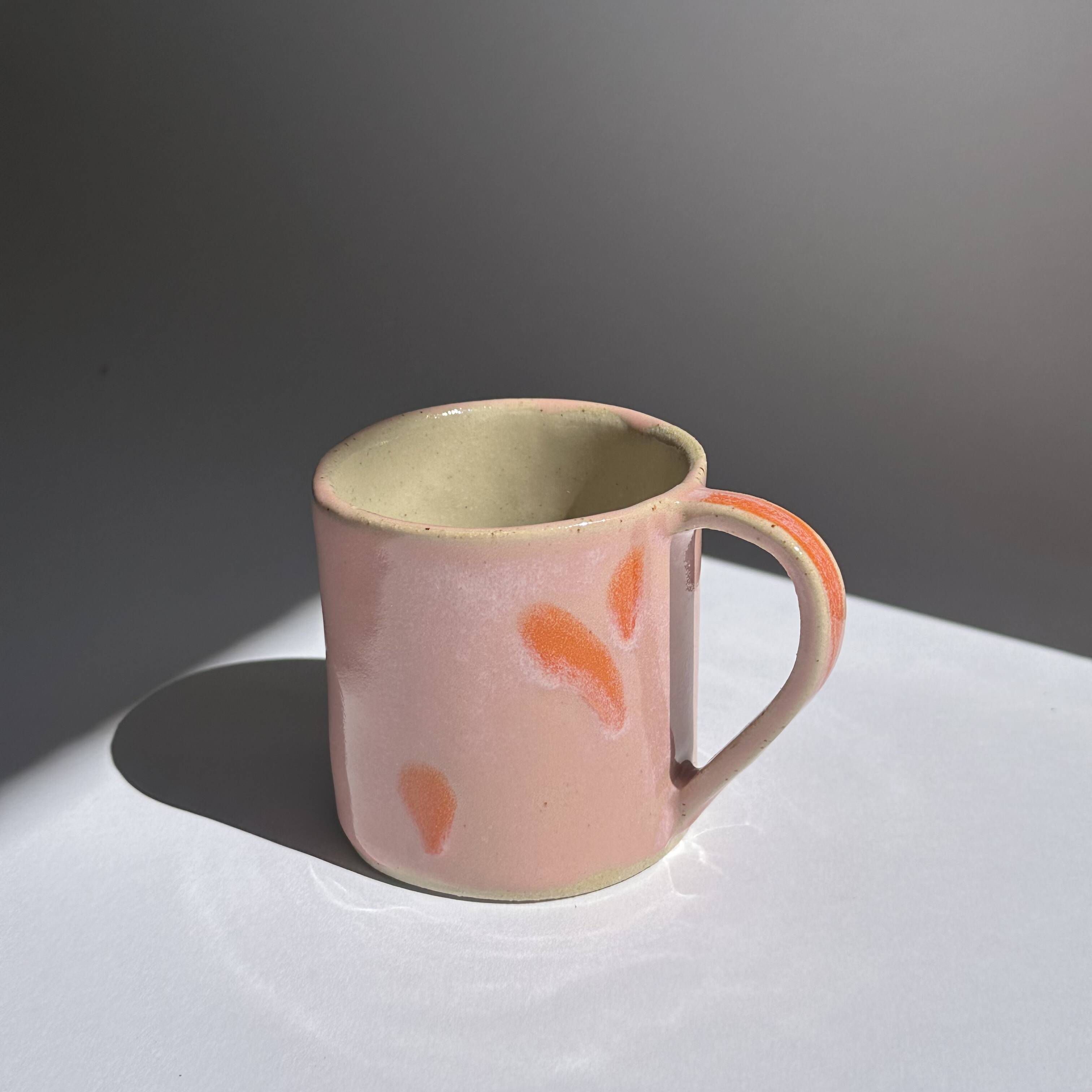 pink and orange mug