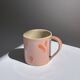 pink and orange mug