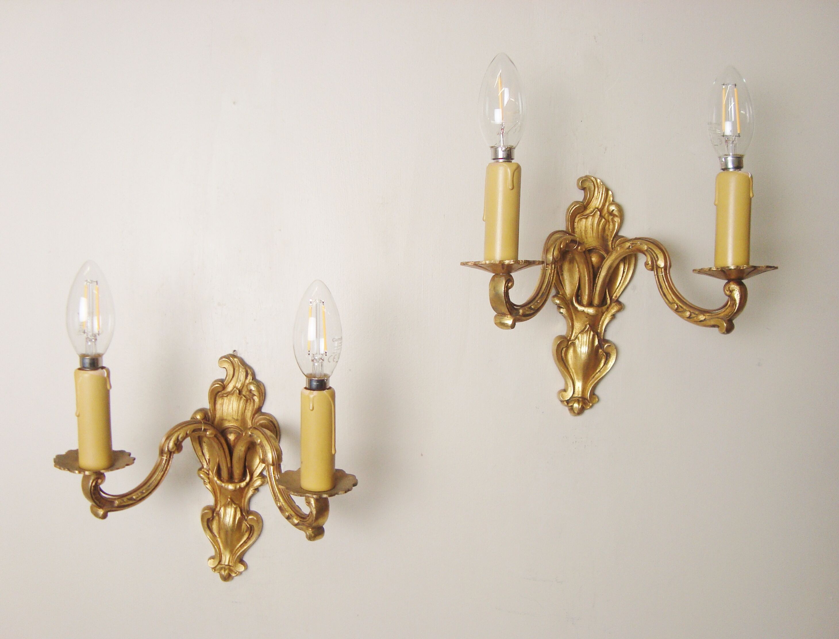 Pair of bronze sconces with four handmade toile de Jouy lampshades in France