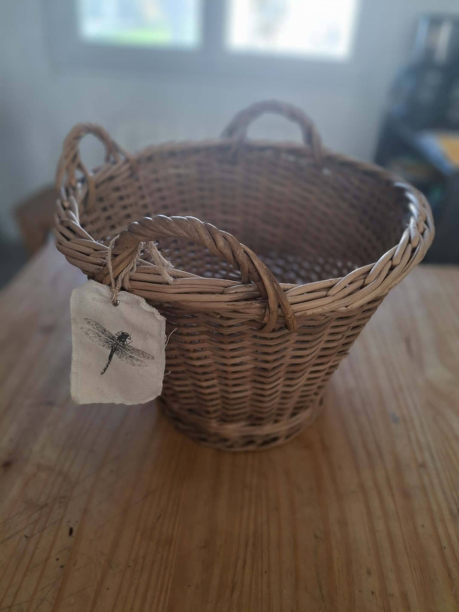 Old wicker basket with 3 handles.
