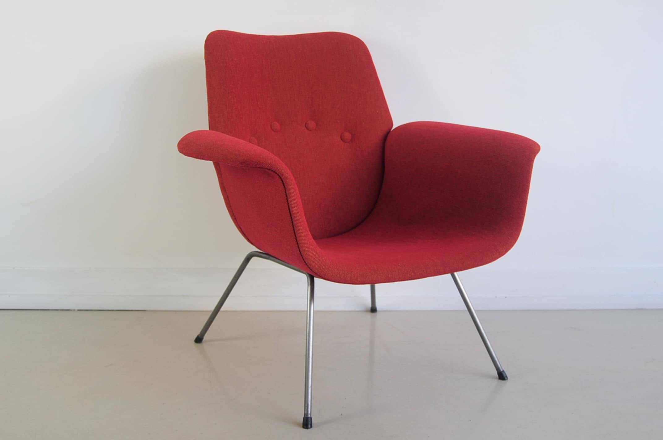Red armchair with metal legs