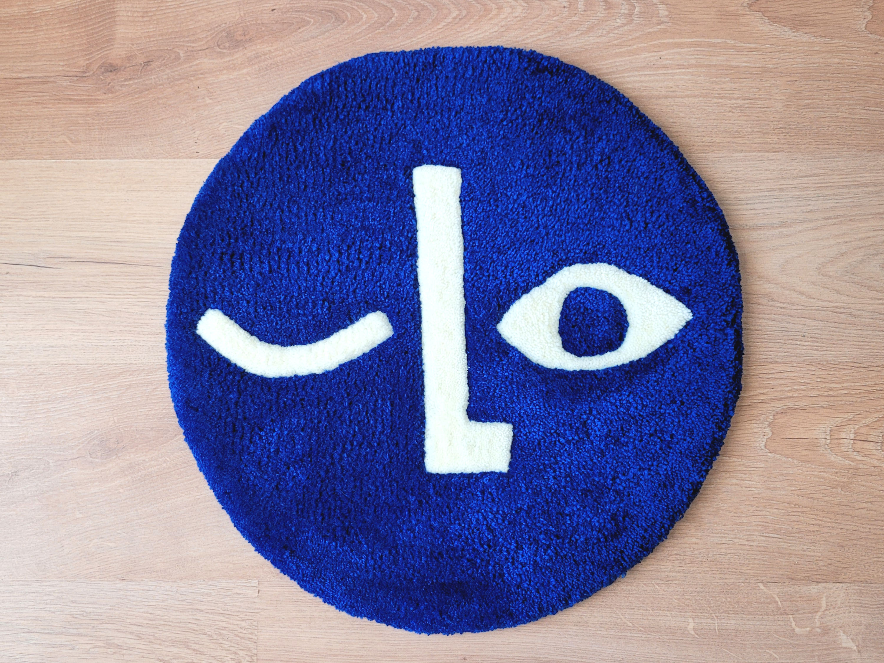 Tapis rond visage bleu roi 54x54cm