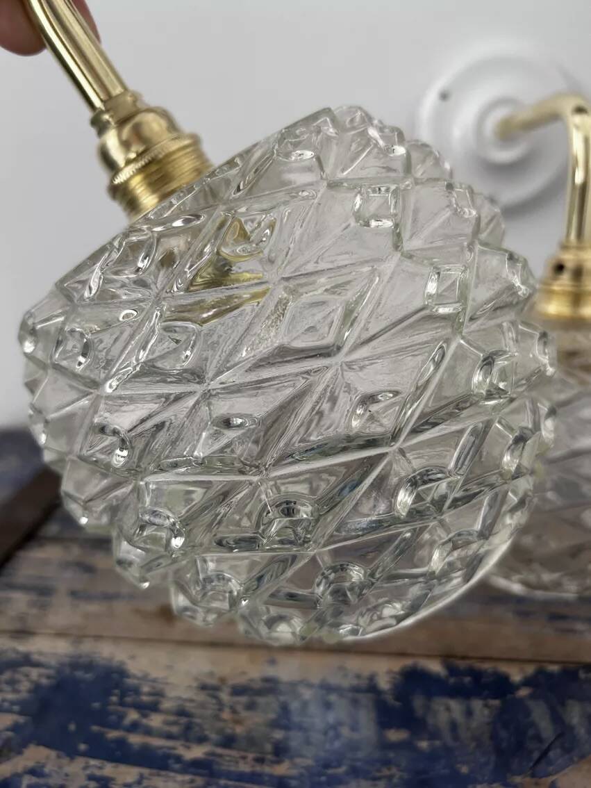 Pair of chiseled glass wall sconces