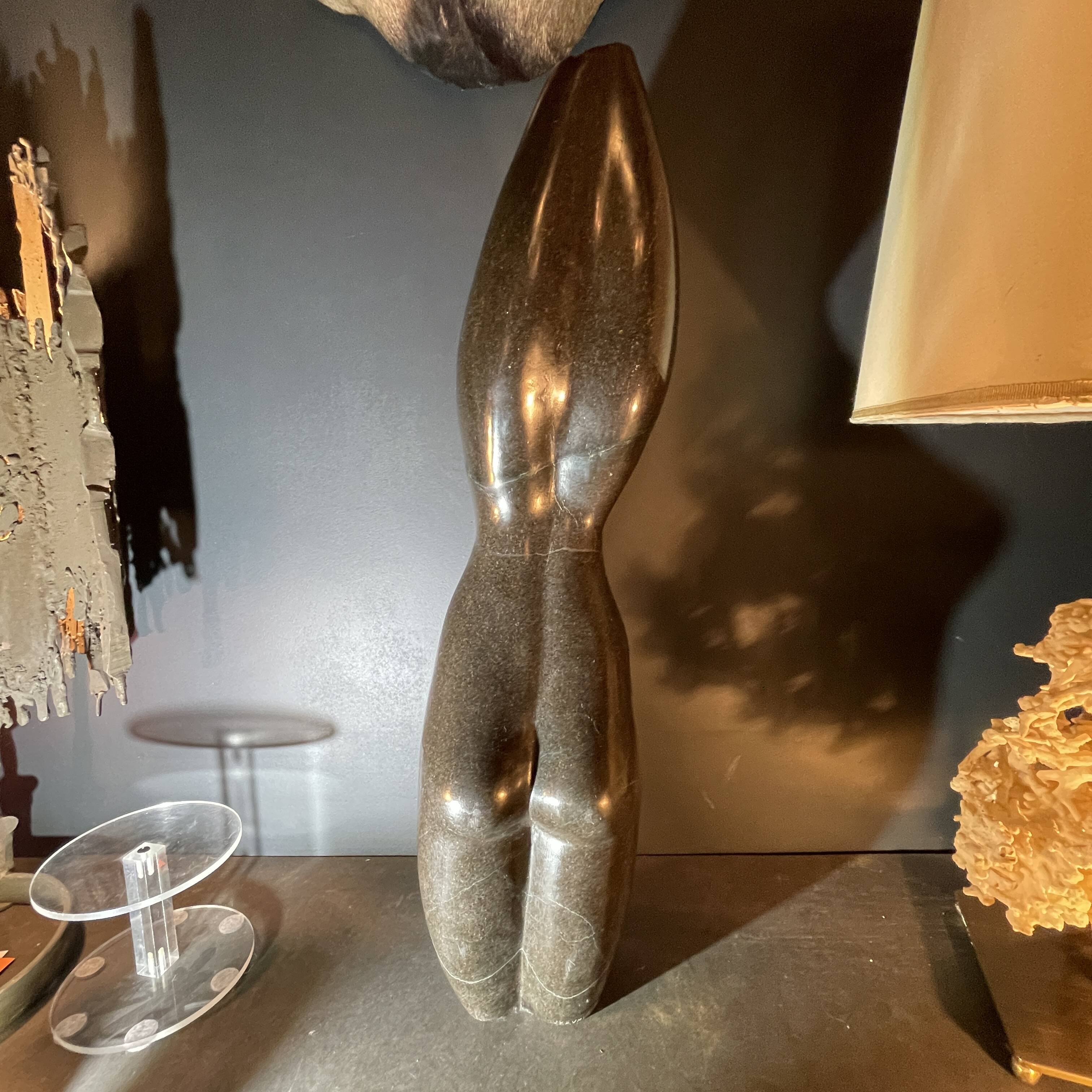 Abstract sculpture "naked woman" in stone (black marble), signed work, 20th century