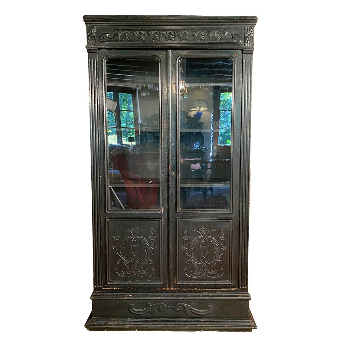 Blackened wooden display cabinet from the late 19th or early 20th century.