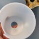 Wall lamps with milky white acrylic plastic shades and solid brass bases
