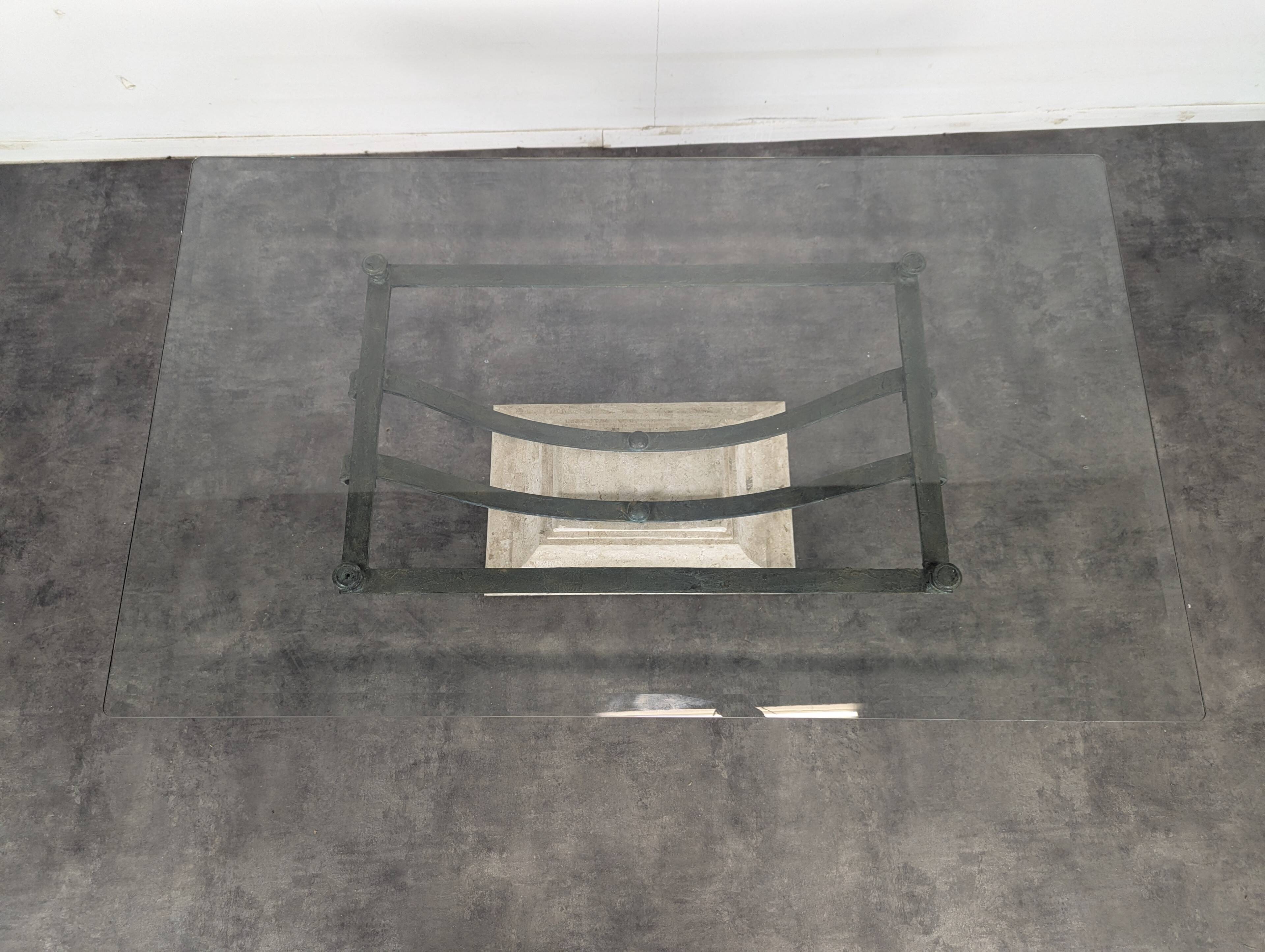 1980s coffee table with a travertine style and glass top.