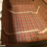 Suitcase vintage leather inside and brown carpeted home