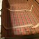 Suitcase vintage leather inside and brown carpeted home