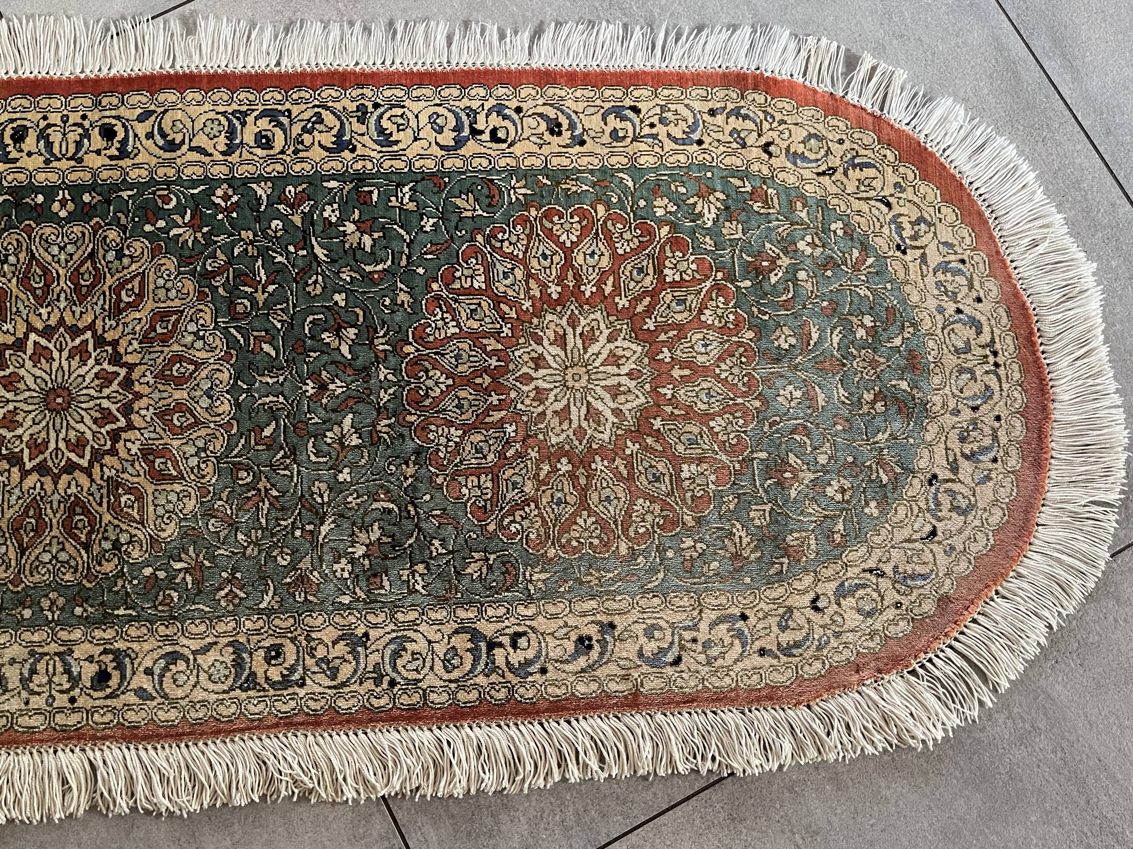 Sino Hereke oval silk rug