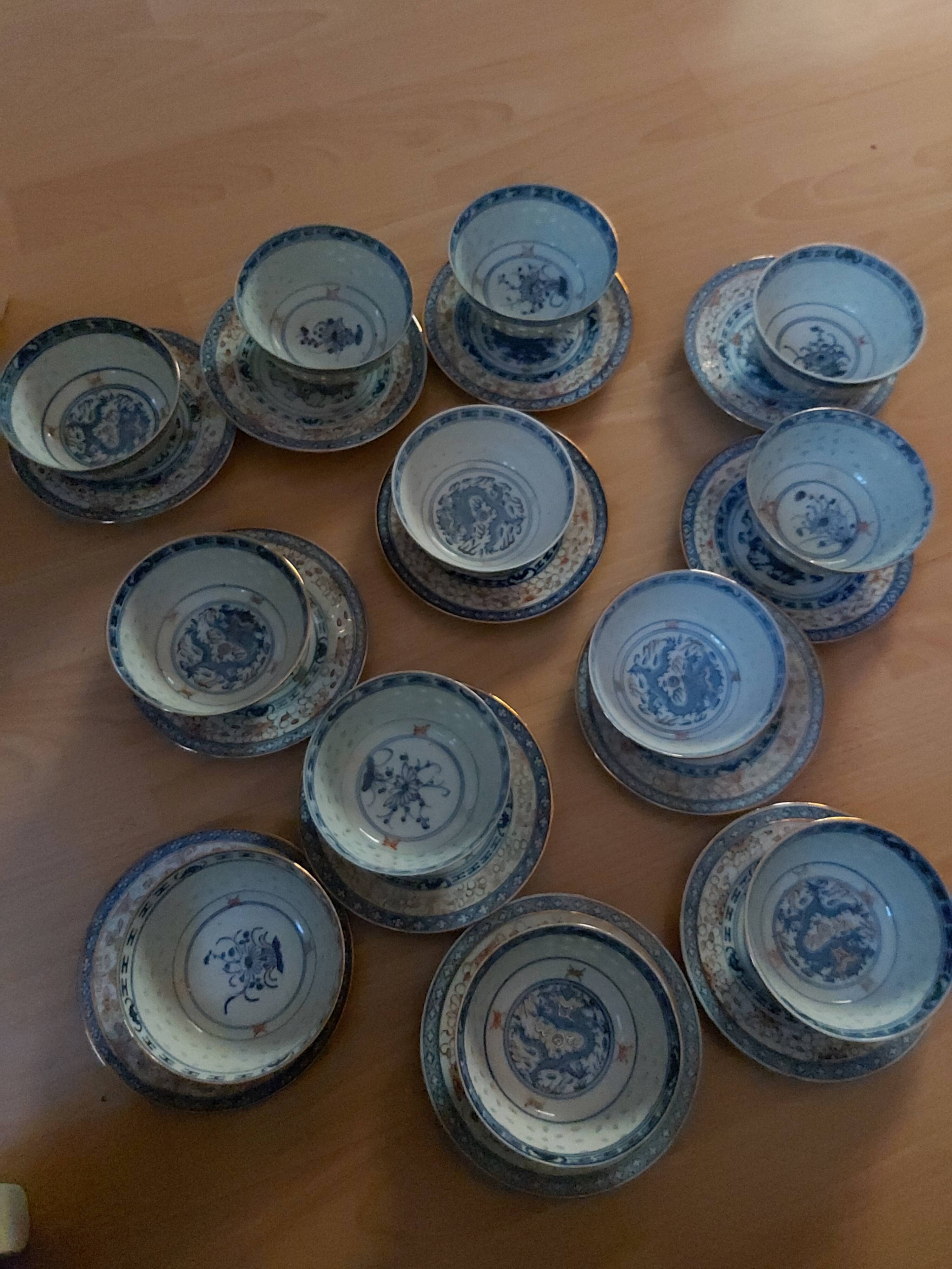 Service of 12 bowls and 12 under dishes in Chinese porcelain called rice seed of the 1960s