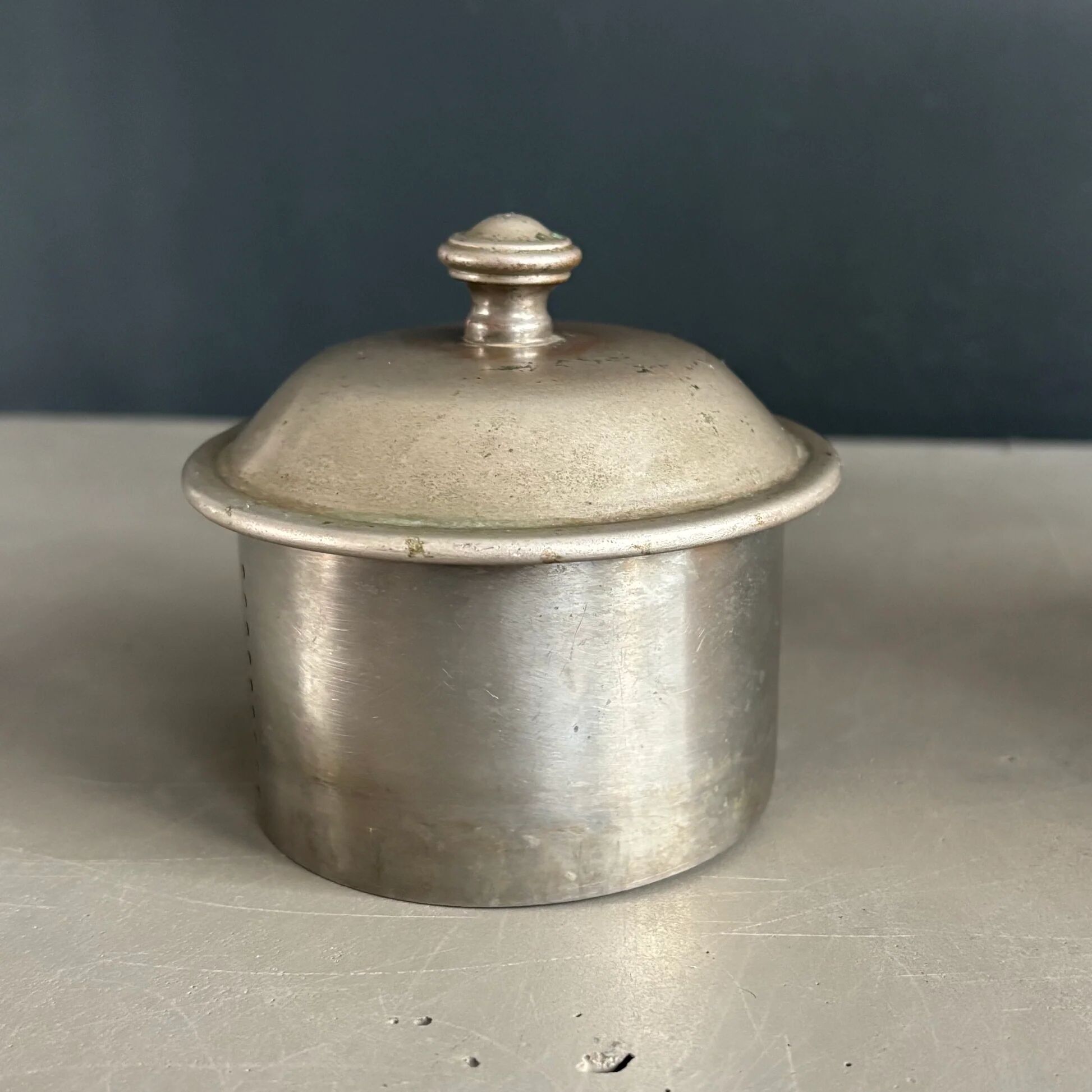 Antique teapot in earthenware with a tin filter lid.