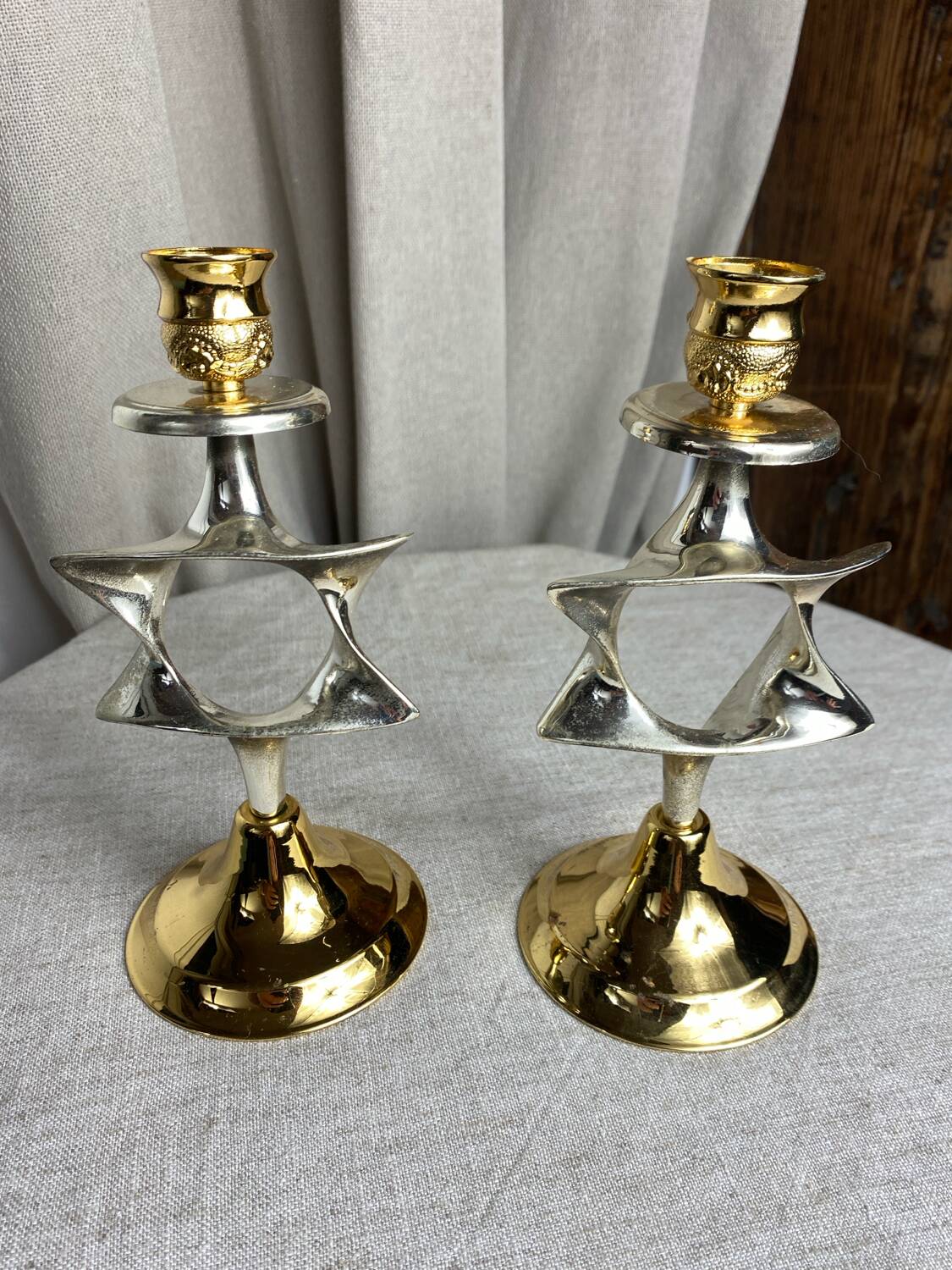 Pair of silver and gold metal candlesticks