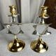 Pair of silver and gold metal candlesticks