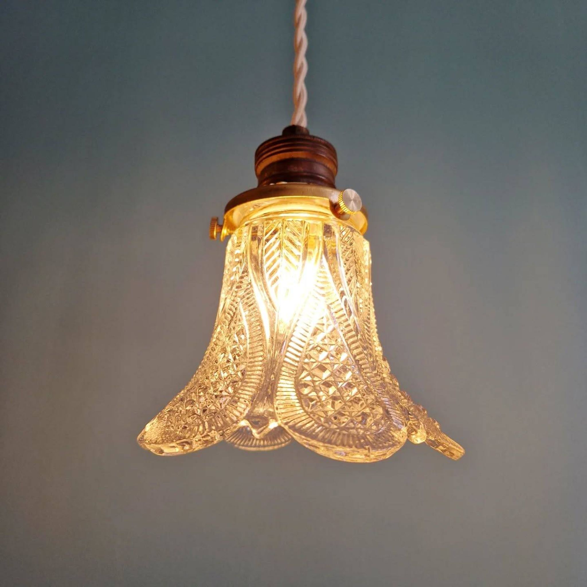 Art Deco trio of pendant lights/table lamps in clear glass, 1920s-30s.