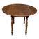 Round kitchen or dining table with extendable leaves in dark wood.