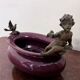 Catch-all or decorative bowl combining a ceramic container.
