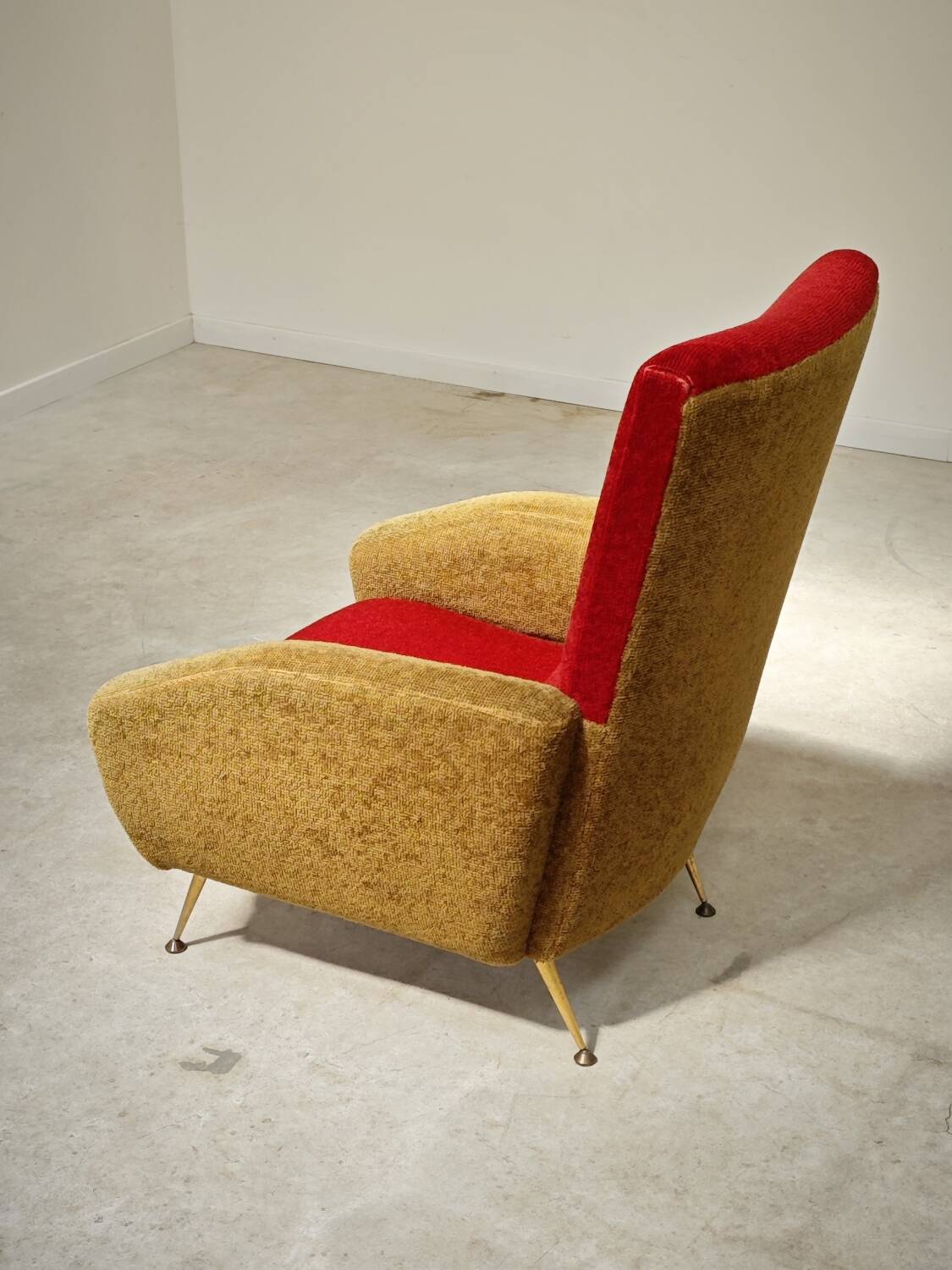 Red and mustard yellow fabric armchair in 1970s style
