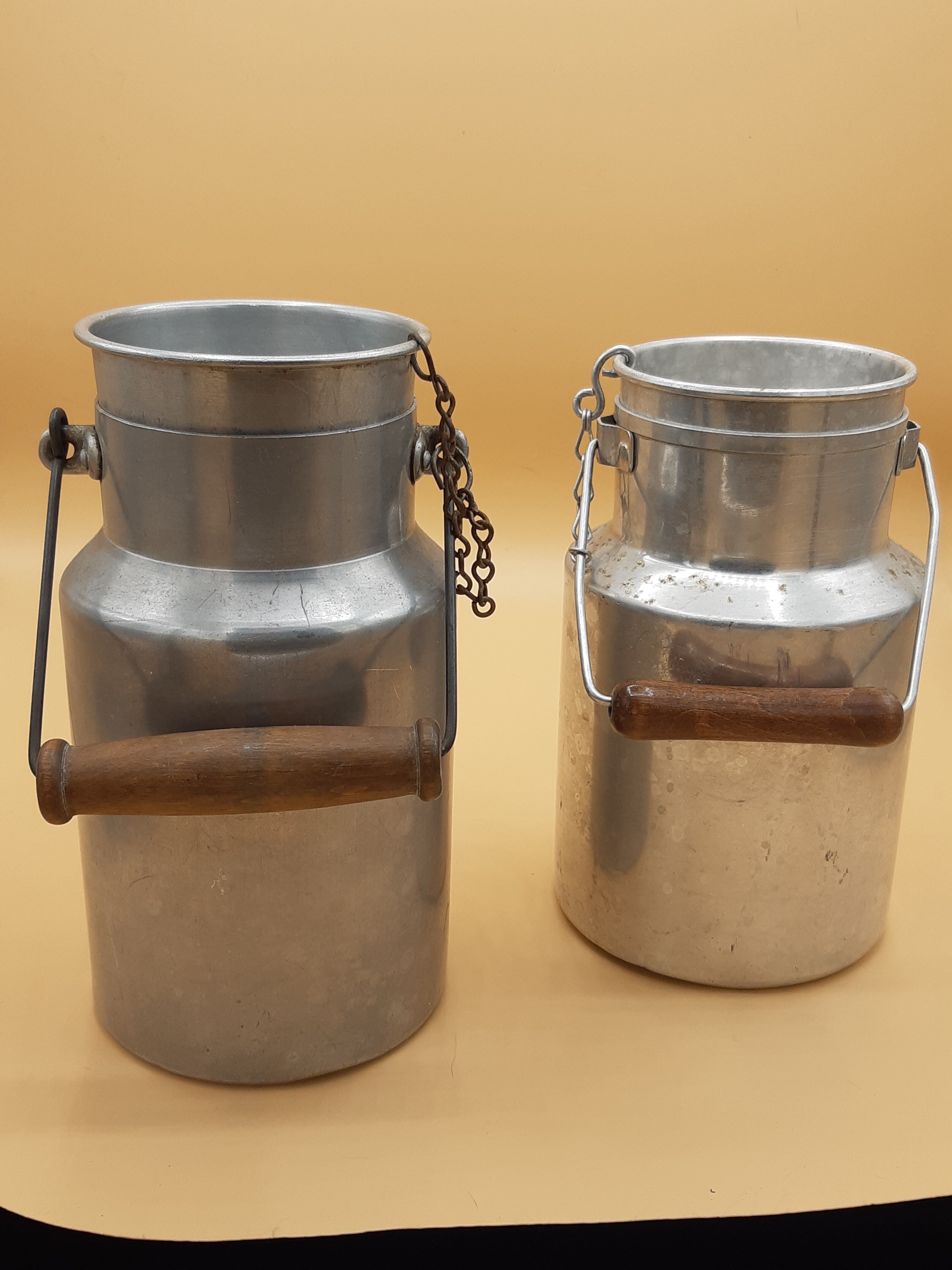 Old aluminum milk jars, wooden handle, lot of 2