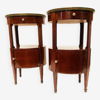 Pair of oval Louis XVI style bedside tables in mahogany and 20th century veneer