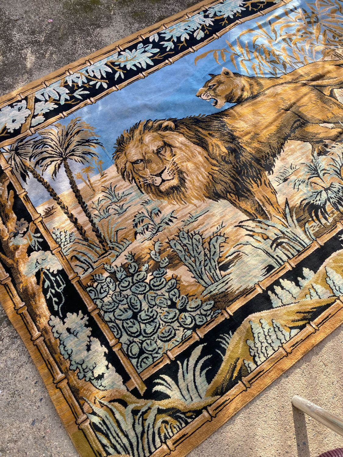 Antique velvet wall tapestry depicting a lion and lioness scene