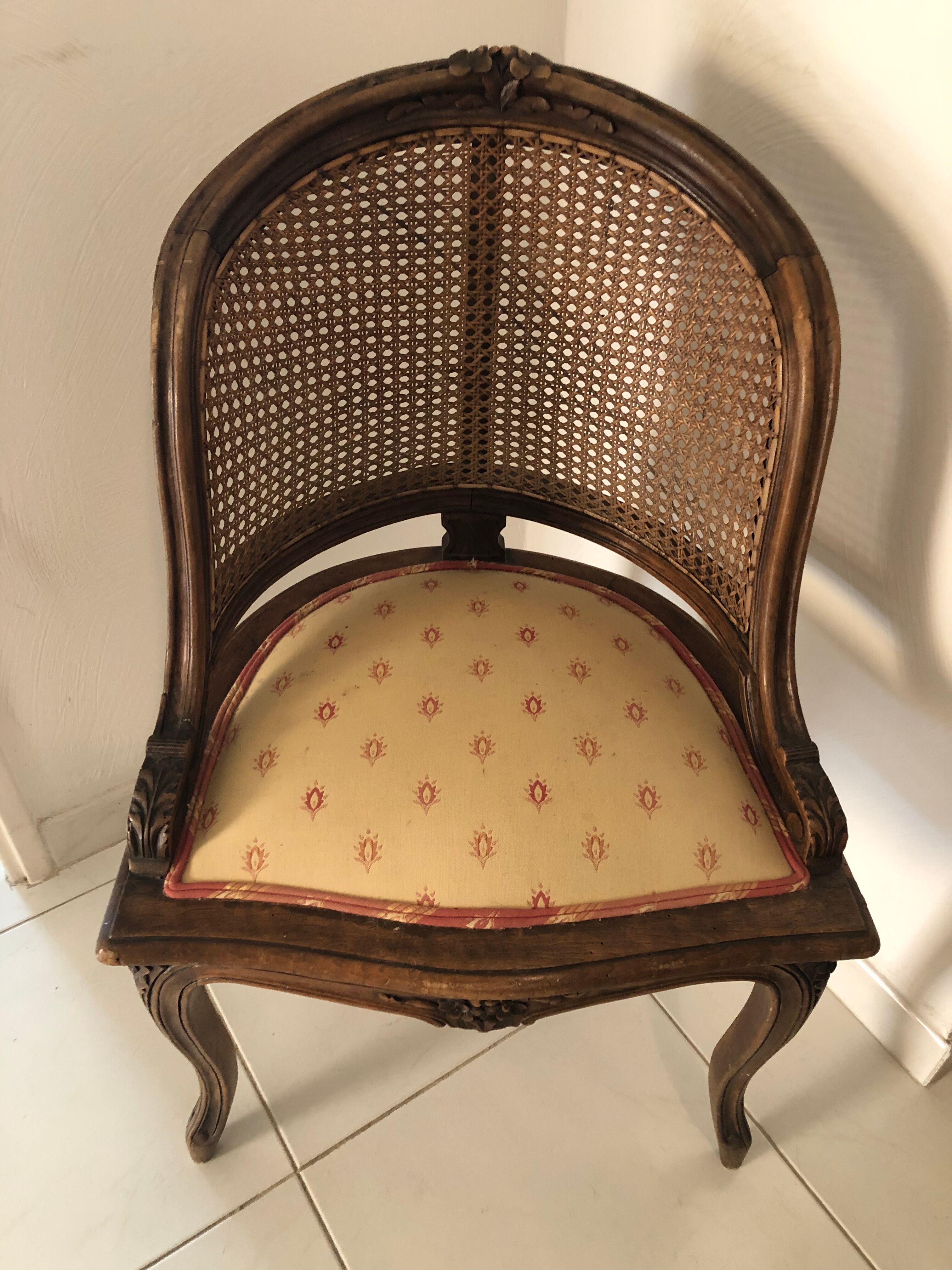 Old wooden armchair and cannage