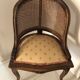 Old wooden armchair and cannage