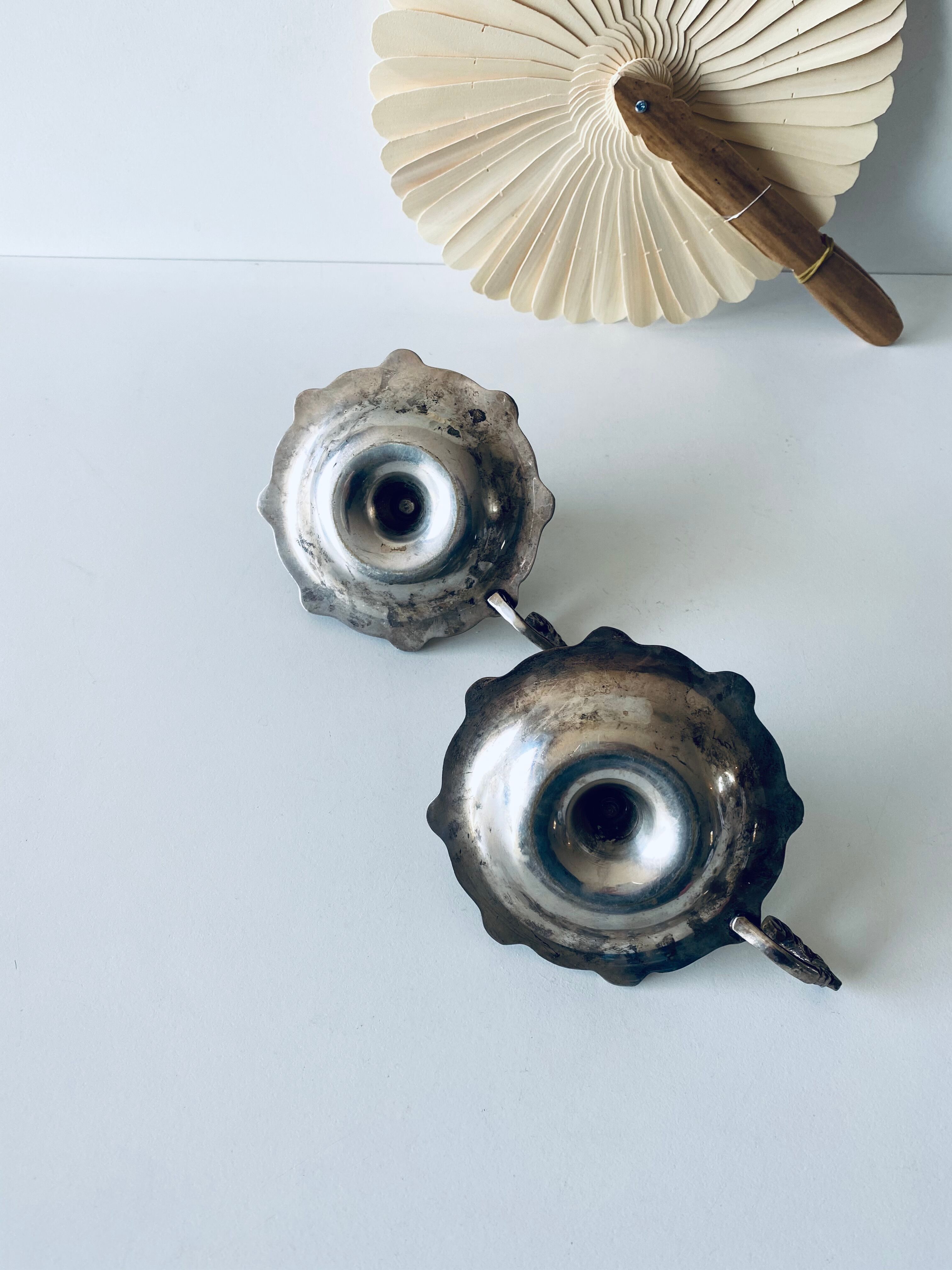 Pair of silver metal candlesticks