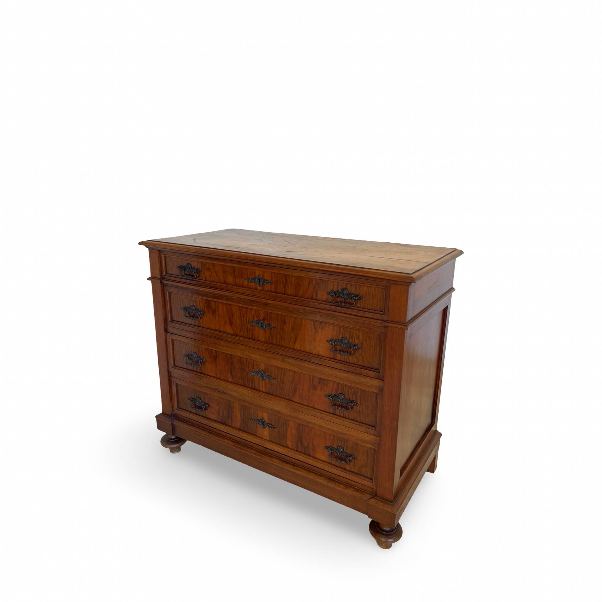 Antique walnut commode with bronze handles in the shape of a lion's mask,