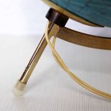 Luminous world map in tripod glass